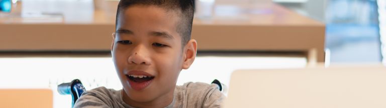 Student in wheelchair at computer